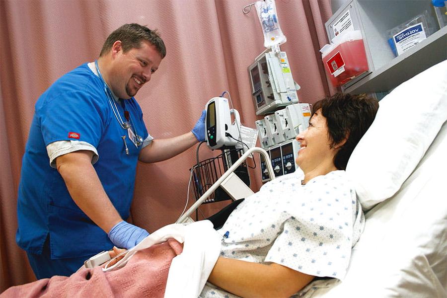 A Medical Assistant taking vitals on a patient